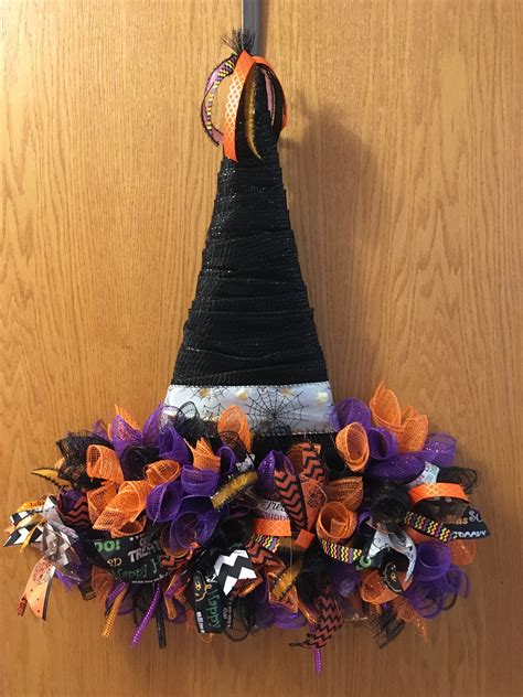 Witch hat adorned pumpkin for halloween decor